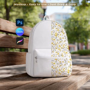 May include: White backpack with a floral pattern on the right side. The backpack has a front pocket with a zipper and a top handle. The text "Mockup • Easy to Use • Just Drag & Drop" is at the top. Software logos for Photoshop, Canva, and Procreate are on the left.