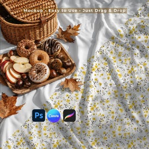 May include: A white fabric mockup featuring a yellow floral pattern, a woven wicker basket, and a wooden tray holding three donuts, sliced apples, and chestnuts. Text reads: Mockup • Easy to Use • Just Drag & Drop. Includes Ps, Canva, and Procreate icons.
