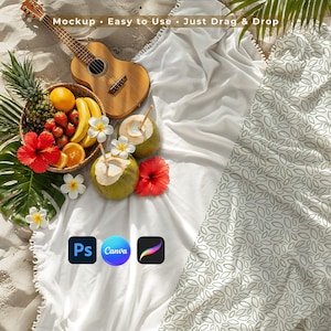 May include: A beach picnic scene with a ukulele, a woven basket of fruit, coconuts, and a patterned blanket. The basket contains a pineapple, oranges, strawberries, and bananas. The text in the image says "Mockup • Easy to Use • Just Drag & Drop".