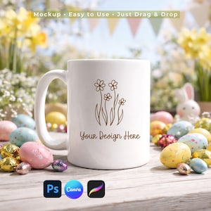 May include: A white ceramic mug with a floral design and the text "Your Design Here". The mug is surrounded by Easter eggs and a bunny figurine. The background includes yellow flowers and the text "Mockup • Easy to Use • Just Drag & Drop".