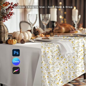 May include: A white tablecloth mockup featuring a yellow and grey floral pattern on one side. The image includes text reading Mockup • Easy to Use • Just Drag & Drop, along with icons for Photoshop, Canva, and Procreate on the left side of the table.