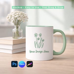 May include: White ceramic mug with a green handle and interior, featuring a floral design and the text "Your Design Here." The image includes the text "Mockup • Easy to Use • Just Drag & Drop" and software icons for Photoshop, Canva, and Procreate.
