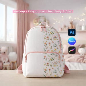 May include: White backpack with a floral and house pattern, featuring pink accents on the zippers and straps. The text "Mockup • Easy to Use • Just Drag & Drop" is displayed at the top. The backpack is designed for children.