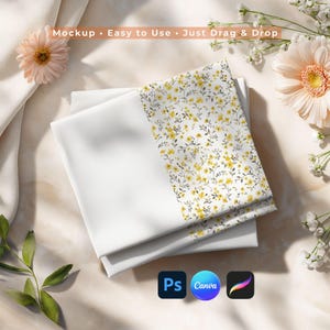May include: Folded white fabric with a floral yellow pattern. The text "Mockup • Easy to Use • Just Drag & Drop" is visible. The image also includes the logos for Photoshop, Canva, and Procreate.