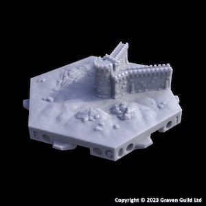 May include: A light gray miniature castle model with a round tower and fortified walls. The castle sits on a hexagonal base with rocky terrain. The model has a detailed design and is likely for tabletop gaming or display.