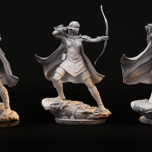 May include: A detailed, gray figurine of an archer in a dynamic pose, drawing back a bow. The archer is clad in armor and a flowing cape, standing on a textured base. The figure is a fantasy-themed collectible.