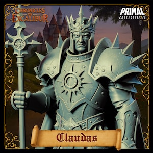 May include: A detailed statue of Claudas from the Chronicles of Excalibur series. The figure is clad in ornate armor, wearing a crown and holding a staff. The statue is a light blue-grey color, with the Primal Collectibles logo in the top right corner.