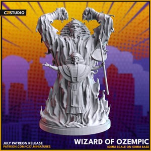 May include: A gray Wizard of Ozempic miniature figure, 40mm scale on a 50mm base. The figure depicts a wizard with outstretched arms, surrounded by flames. The figure is set against a purple and yellow background. Text includes "Wizard of Ozempic" and "July Patreon Release".