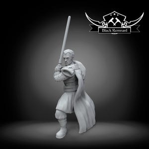 May include: A gray figurine of a person holding a lightsaber, wearing armor and a cape. The figurine has the text "Black Remnant" in a banner above the figure. The figure is in a fighting stance.