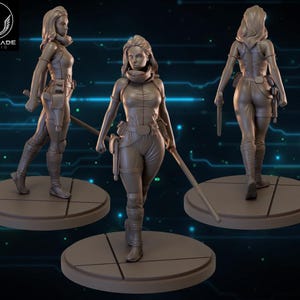 May include: A 3D model of a female figure in a futuristic outfit, holding a sword. The figure is in a dynamic pose, with detailed clothing and accessories. The model is displayed on a circular base, with the Wardlade Studio logo visible.