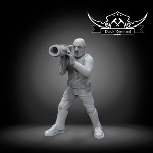 May include: A grayscale figurine of a person holding a large cylindrical device, possibly a weapon or tool. The figure is wearing a sleeveless top, pants, and boots. The Black Remnant logo is in the upper right corner.