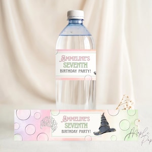 May include: A clear water bottle with a label that reads "Ammeline's Seventh Birthday Party!" in pastel colors. The label features a witch hat illustration. A matching label is below the bottle.