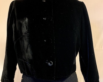 1960s, 40" bust, short black velvet with raglan  sleeves.
