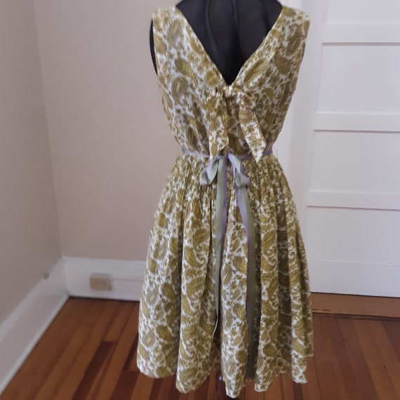 1950s 38 bust, open neckline, sleeveless sun dres