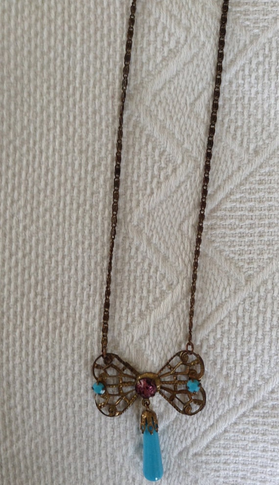 1920's brass bow necklace. - image 3