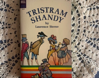 May include: A vintage paperback book cover with a colorful illustration of people and a horse. The book title is "Tristram Shandy" by Laurence Sterne. The Dell Laurel Edition logo is in the top left corner and the price is 75 cents.