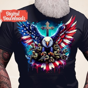 May include: A dark blue t-shirt featuring a graphic of an eagle with American flag wings, a cross, and soldiers holding rifles. The eagle is perched on a red, white and blue American flag.