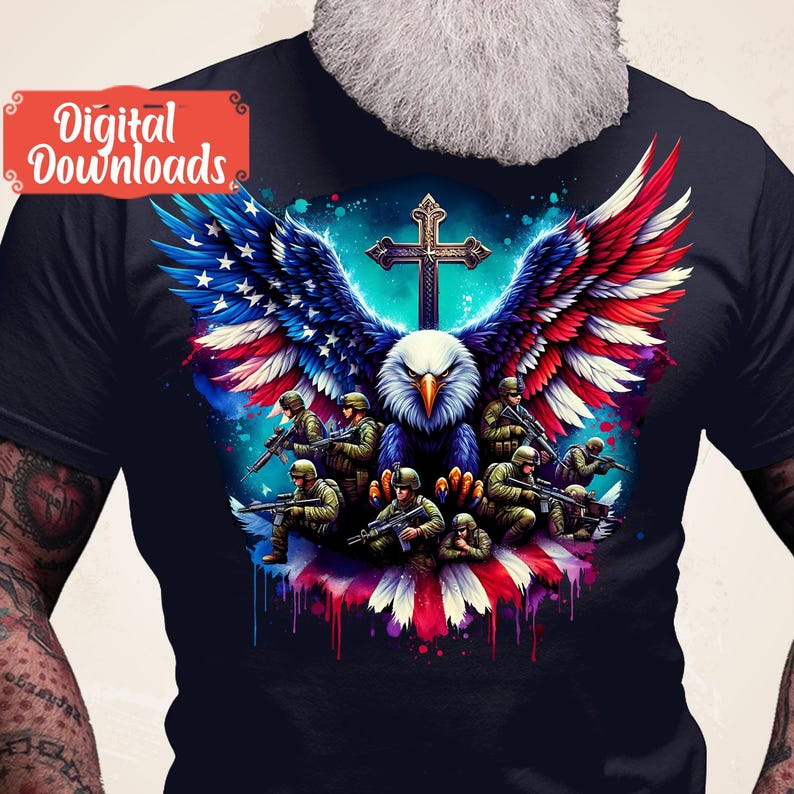 May include: A dark blue t-shirt featuring a graphic of an eagle with American flag wings, a cross, and soldiers holding rifles. The eagle is perched on a red, white and blue American flag.