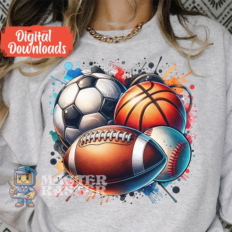 May include: A light gray sweatshirt featuring a colorful graphic of a soccer ball, basketball, football, and baseball. The design includes watercolor paint splatters and the text "Digital Downloads".