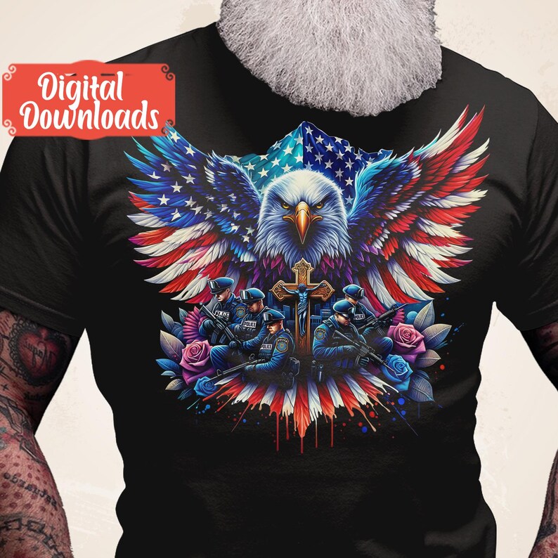 May include: A black t-shirt with a graphic of an American bald eagle with its wings spread wide, holding a cross. The eagle is superimposed over an American flag. Five police officers are standing in front of the eagle, holding guns and wearing blue uniforms. The graphic is surrounded by red, white, and blue flowers.