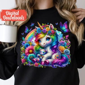 May include: A colourful rainbow unicorn with a flower crown and a teddy bear, surrounded by flowers and butterflies on a black background.