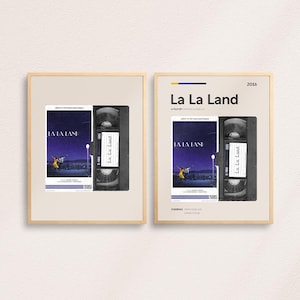May include: A vintage VHS tape mockup with a poster for the movie "La La Land" featuring a couple dancing on a rooftop. The poster is in a wooden frame with a white background. The text "La La Land" is in a bold, sans-serif font.