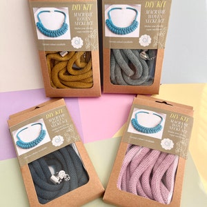 May include: Four DIY kits for making macrame woven necklaces. Each kit includes a length of rope in a different colour: teal, mustard yellow, grey, and pink. The kits also include instructions and a clasp.