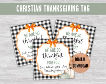 May include: Three printable Thanksgiving gift tags with a black and white buffalo plaid background. The tags feature a handwritten message that says "We are so thankful for you" with a green and orange floral design. The text "God bless you this Thanksgiving!" is also included on the tag.