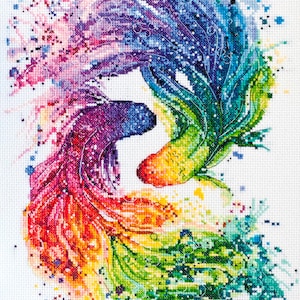 May include: Two colorful fish with flowing tails, resembling a watercolor painting. The fish are in a circular pattern, with one fish facing clockwise and the other counterclockwise. The fish are a rainbow of colors, including red, orange, yellow, green, blue, and purple.