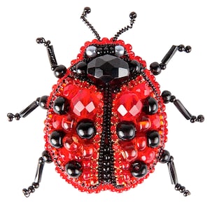 May include: A decorative ladybug brooch with a vibrant red body, adorned with faceted red gems and black accents. The ladybug's head is a large, black, faceted gem, and it has delicate black antennae and legs. This handcrafted brooch is a unique accessory.