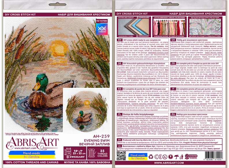 May include: Cross stitch kit featuring a detailed image of a duck swimming in a pond at sunset. The kit includes 35 colors of thread and a Zweigart Aida fabric. The kit is titled "Evening Swim" and is labeled "AH-259".