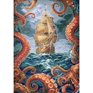 May include: Cross-stitch artwork depicting a sailing ship on a stormy sea, surrounded by large, orange octopus tentacles. The ship is brown with white sails, set against a blue and green background. The tentacles have suction cups.