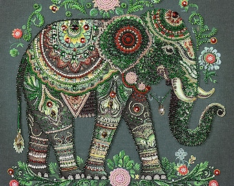 May include: A green, red and gold beaded elephant with intricate floral designs. The elephant is standing on a green background with flowers.