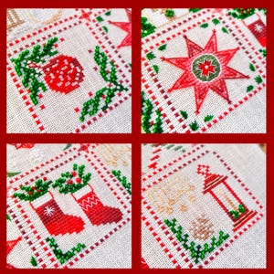 May include: Close-up of a Christmas-themed cross-stitch design. The design features red and green elements, including a star, ornaments, stockings, and a lantern, all set against a white background with a red border. The embroidery is detailed and festive.