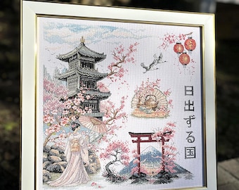May include: Framed cross-stitch artwork depicting a Japanese landscape with a pagoda, cherry blossoms, and a woman in a kimono. The artwork includes the Japanese text "Land of the Rising Sun" and is framed in a white and gold frame.
