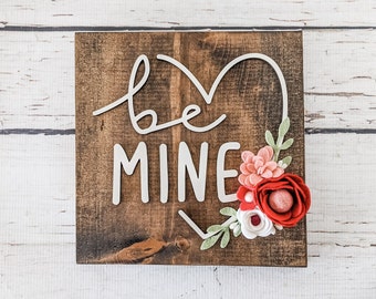 Be mine sign with felt flowers