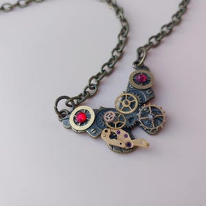 Steampunk Bronze Butterfly Pendant with Gold Gears and Red Swarovski Crystals on a Bronze Chain