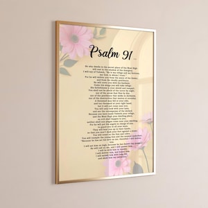 Puede incluir: Impresión enmarcada con el texto del Salmo 91, con un marco dorado y un fondo crema. El texto es negro, con el título "Salmo 91" en una fuente decorativa. Acentos florales rosas se colocan en las esquinas.