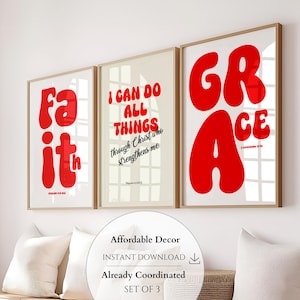 May include: Set of three framed art prints with inspirational quotes in red lettering. The prints say "Faith", "I can do all things through Christ who strengthens me", and "Grace". The frames are a light brown color.