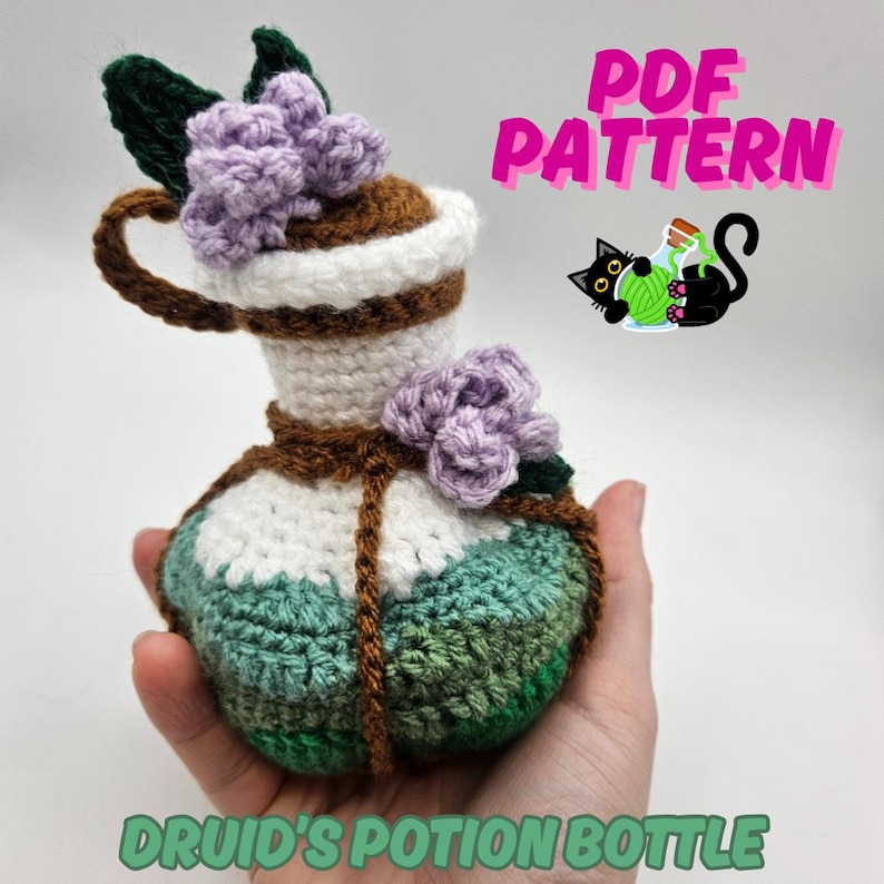 Text reads: Druid's Potion Bottle. Pictured is a round crocheted potion bottle with waves of green and purple flower, perfect for nature based characters in DnD, CnC, TTRPGs, Magic the Gathering, Ren Faire, Cosplay accessories.