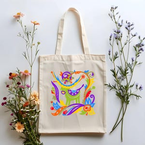 Eine Einkaufstasche im folkloristischen Stil mit einem Blumen- und Stiermuster Baumwollsegeltuch-Einkaufstasche für Einkaufstouren Stilvolles Accessoire für Spaziergänge