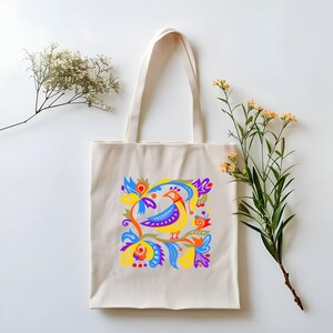 Eine Einkaufstasche im folkloristischen Stil mit einem Blumen- und Vogelmuster Baumwollsegeltuch-Einkaufstasche für Einkaufstouren Stilvolles Accessoire für Spaziergänge