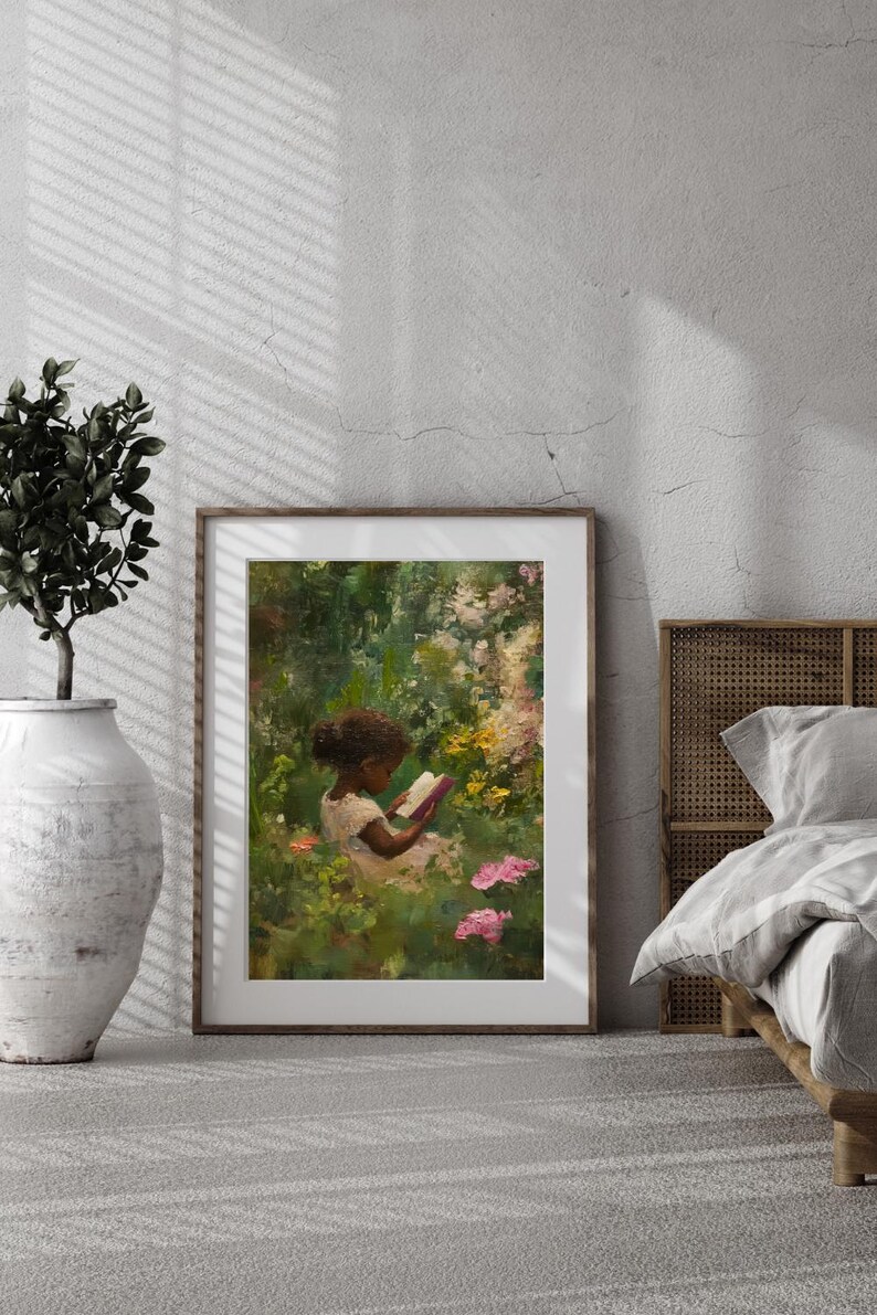 May include: A framed painting of a young girl sitting in a garden, reading a book. The girl is wearing a white dress and has dark brown hair. The garden is lush and green, with pink flowers in the foreground.