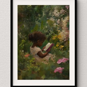 May include: A young girl with dark brown hair sits in a garden, reading a book. She is wearing a white dress and is surrounded by green foliage and pink flowers.