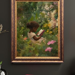 May include: A framed oil painting of a young girl sitting in a garden reading a book. The girl is wearing a white dress and has dark hair. The garden is filled with green foliage and pink flowers.