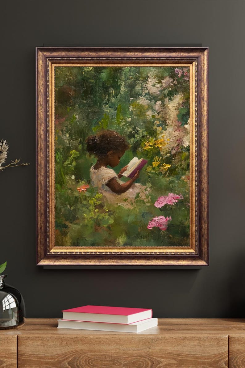 May include: A framed oil painting of a young girl sitting in a garden reading a book. The girl is wearing a white dress and has dark hair. The garden is filled with green foliage and pink flowers.