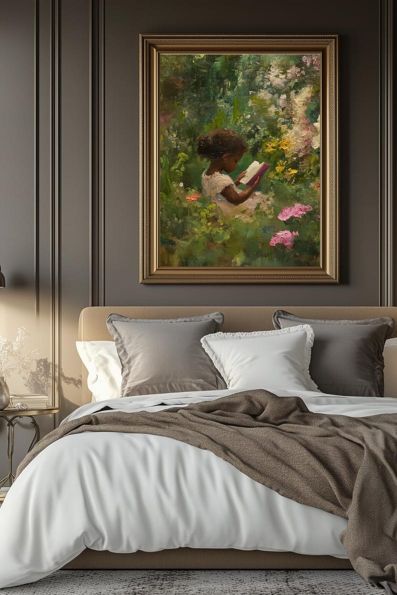 May include: A framed oil painting of a young girl sitting in a garden, reading a book. The girl is wearing a white dress and has dark hair. The garden is filled with lush greenery and pink flowers.