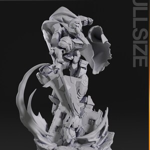 Figurine 3D à peindre du Gundam Barbatos de Mobile Suit Gundam Iron-Blooded Orphans, sculpture en résine représentant le mecha en pose de combat dynamique brandissant sa masse d'armes caractéristique, cape rouge flottante, posé sur un socle de ruines avec effets d'impact, armure grise et bleue aux détails angulaires, statue de collection garage kit créée par le sculpteur bulkamancer
