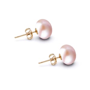 May include: A pair of stud earrings featuring round, light pink pearls with a smooth, lustrous finish. Each pearl is securely mounted on a gold-toned metal post with a matching butterfly-style friction back closure for a secure fit.