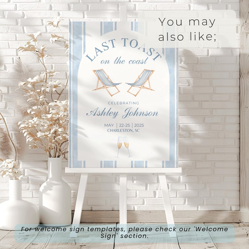 May include: A blue and white striped welcome sign with the text "Last Toast on the Coast" in a white arch. The sign also includes the text "Celebrating Ashley Johnson" and the date "May 22-25 | 2025" and the location "Charleston, SC".